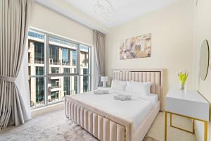 Postel nebo postele na pokoji v ubytování Boulevard Central 2 by Luxstay Holiday Homes