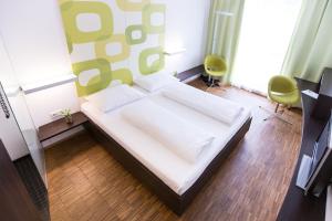 Postel nebo postele na pokoji v ubytování arte Hotel Krems