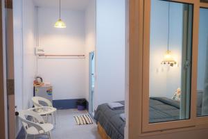Postel nebo postele na pokoji v ubytování Koh Kood Chonthicha Homestay