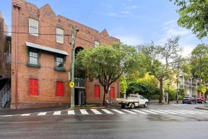 a truck parked in front of a brick building at 2-4 Trinity Avenue in Sydney