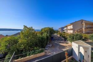 an apartment balcony with a view of a street at Villa Vista Maris in Crikvenica