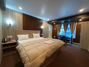 Postel nebo postele na pokoji v ubytování Hotel Basera