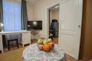a bowl of fruit on a table in a room at Cozy and Quit Stay in Tartu Woody Karlova & Free Parking in Tartu