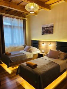 Postel nebo postele na pokoji v ubytování Harmónia Vendégház + 37 fotografií