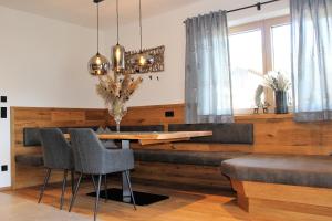 a dining room with a table and chairs at Appartement Steger in Mittersill