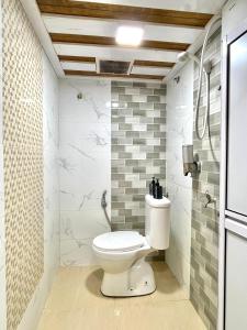 a bathroom with a toilet in a room at Suza Hostel in Tumpat +33 photos