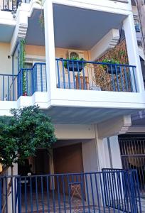 a building with a balcony with blue railing at central sweet home in Larisa