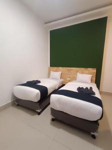 Voodi või voodid majutusasutuse D'Hills Hotel toas