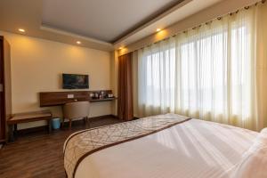 TV a/nebo společenská místnost v ubytování Gorakha Hotel