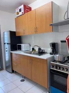 Photo de la galerie de l'établissement Apartamento T2 Equipado e Aconchegante., à Praia