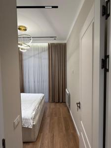 Postel nebo postele na pokoji v ubytování Apartment A