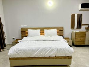 Postel nebo postele na pokoji v ubytování Coshelter Apartments