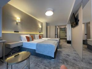 TV a/nebo společenská místnost v ubytování Hotel Univers
