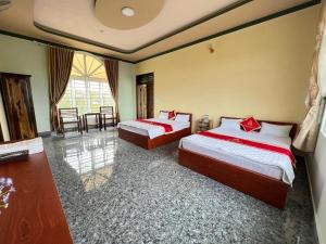 Letto o letti in una camera di Hồng Ngọc 2 Hotel Tà Đùng