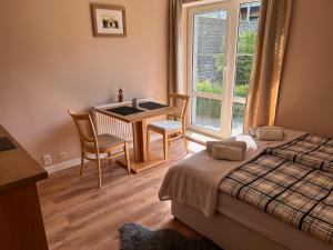 Postel nebo postele na pokoji v ubytování Apartmány Gryf Harrachov