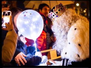 a stuffed teddy bear wearing a tiara holding a balloon at Parrot’s House in Lloret de Mar