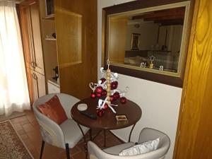 a room with a table and chairs and a mirror at Αρχοντικό Κορκόντζελου in Nafpaktos +12 photos