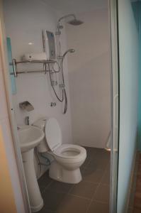 a bathroom with a toilet and a sink at Hotel 57 USJ 21 Subang Jaya in Subang Jaya