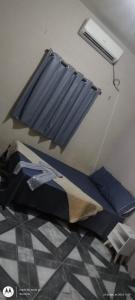 Ένα ή περισσότερα κρεβάτια σε δωμάτιο στο Ampla casa com acesso ao Rio