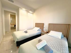 Giường trong phòng chung tại Residence Amanecer +20 ảnh