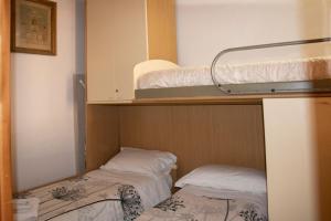 Postel nebo postele na pokoji v ubytování Vintage Flat Ligurian's style