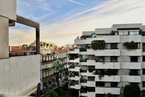 an apartment building with trees on the facade at Gray d'Albion POL519 studio in Cannes
