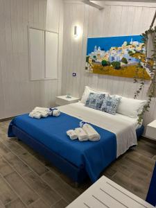 Giường trong phòng chung tại B&B Santorini