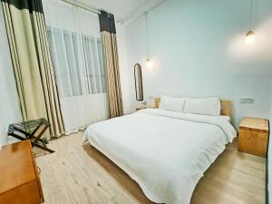 A bed or beds in a room at A&G Apartment