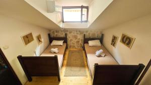 Postel nebo postele na pokoji v ubytování Old Town Homestel + 4 fotografie