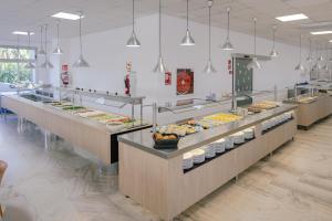 a buffet line with many different types of food at Port Europa in Calpe