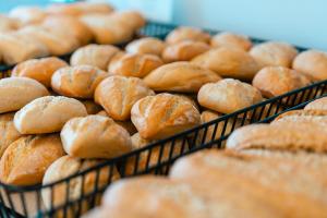 a bunch of breads in baskets on a table at Port Europa in Calpe