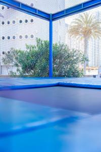 a tennis court with a net on top of it at Port Europa in Calpe