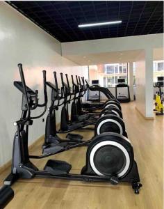 a row of exercise bikes in a gym at The Heart of Urban in Nairobi +2 photos