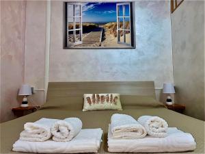 Voodi või voodid majutusasutuse B&B I Candelieri toas