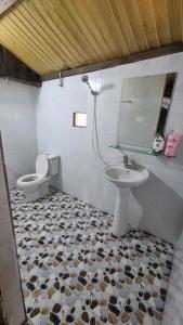 a bathroom with a sink and a toilet at Hello Mu Cang Chai Homestay & Tours in Mù Cang Chải