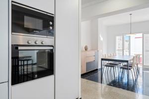 Kuchyňa alebo kuchynka v ubytovaní Hauzify I Apartament Riera + 20 fotografií