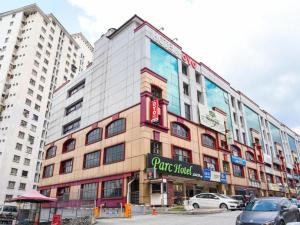 a large building with a sign on the side of it at Parc Hotel Pelangi Damansara in Kuala Lumpur