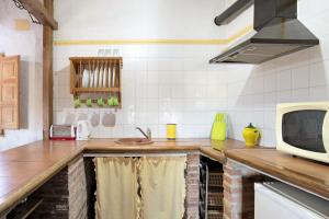 Kuchyň nebo kuchyňský kout v ubytování Casa Alucema