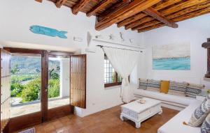 a living room with a couch and a table at Villa Sada in Santa Eularia des Riu