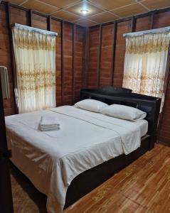 Ένα ή περισσότερα κρεβάτια σε δωμάτιο στο Leamsai House