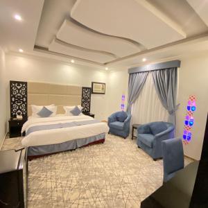 Giường trong phòng chung tại City Center Plaza Aparthotel