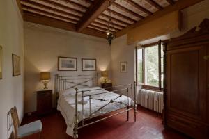 a bedroom with a bed and a window at Timeless Elegance in Poggibonsi +73 photos