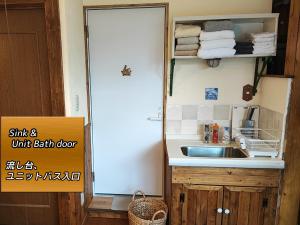 a small kitchen with a sink and a counter at Folks House Room B in Eniwa +11 photos