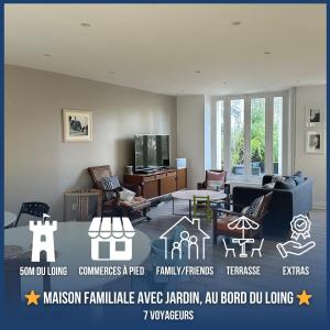 a living room with a couch and a table at Maison familiale-jardin-50m du Loing-tout à pieds in Moret-sur-Loing