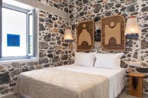 Postel nebo postele na pokoji v ubytování Aurora House Astypalea A
