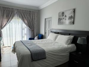 Postel nebo postele na pokoji v ubytování Bobisemo Luxury Guesthouse
