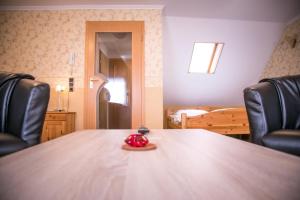 Postel nebo postele na pokoji v ubytování Hotel Am Rathaus