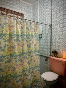 a bathroom with a shower curtain and a toilet at Cosy Spacious Private Room with Ensuite Bath Near LRT Station in Petaling Jaya