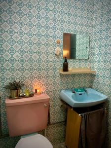 a bathroom with a sink and a toilet and a mirror at Cosy Spacious Private Room with Ensuite Bath Near LRT Station in Petaling Jaya +3 photos