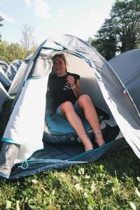 a woman sitting inside of a tent at Løst Souls Oktoberfest Campsite in Munich +14 photos